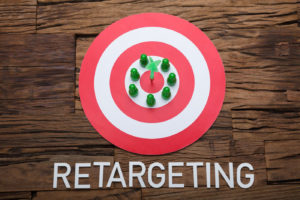 Arrow And Pawn Figurines On Dartboard With Retargeting Text