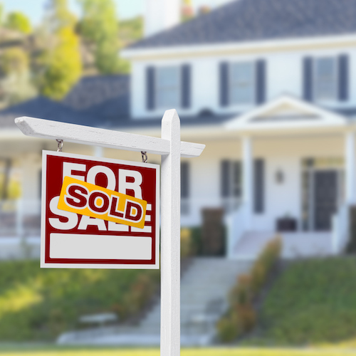 Sold Home For Sale Sign in Front of New House