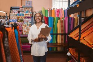 A women stand in cloths shop