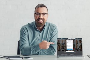 A man using linkedIn on laptop